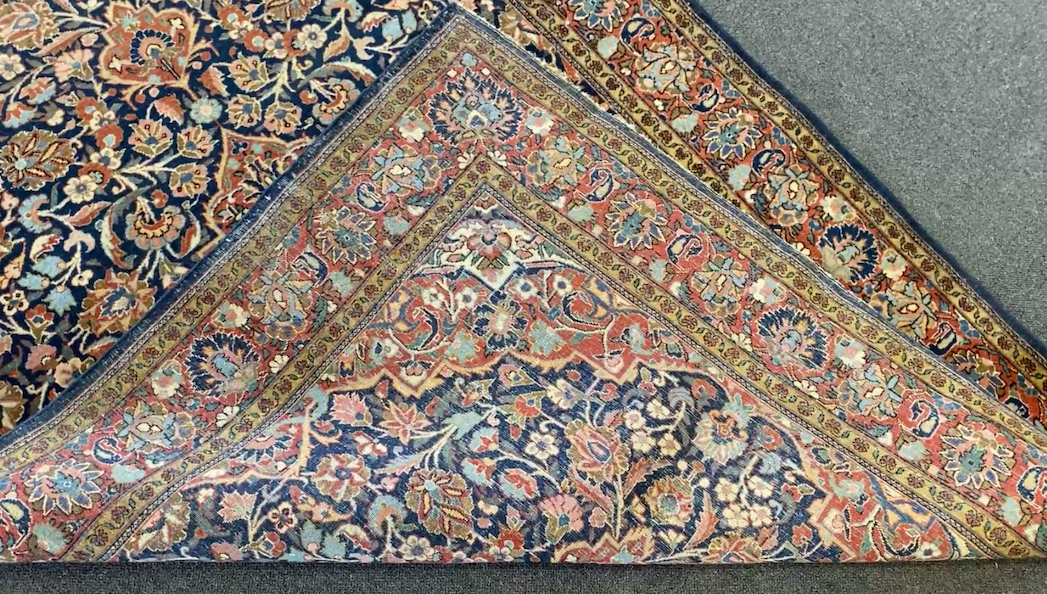 A pair of Kashan blue ground rugs, 213 x 139cm